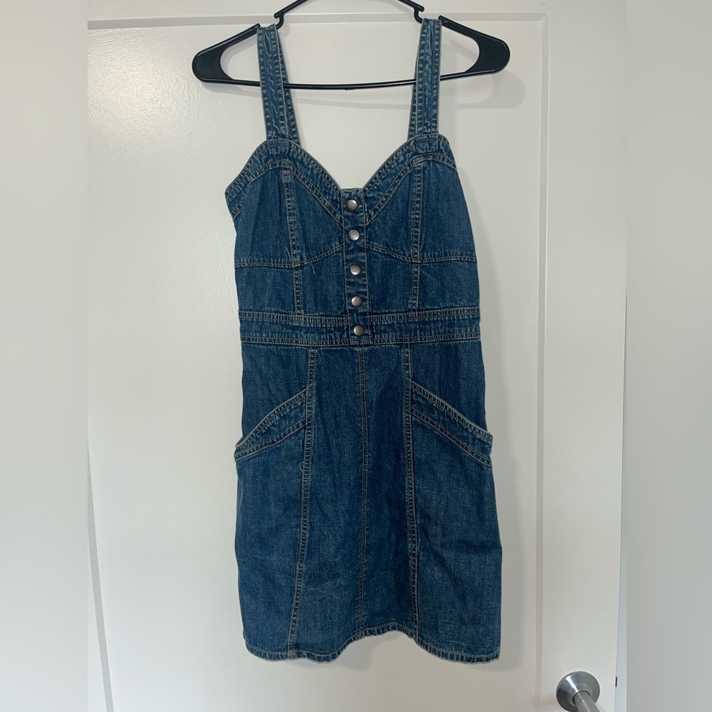 Jean dress. More fitted on top and flows out.